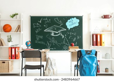 Interior of empty classroom with blackboard, shelf units and desks - Powered by Shutterstock