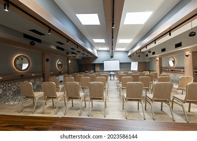 Interior Of A Empty Hotel Seminar Room With Chairs In A Row