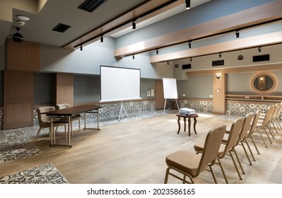 Interior Of A Empty Hotel Seminar Room With Chairs In A Row