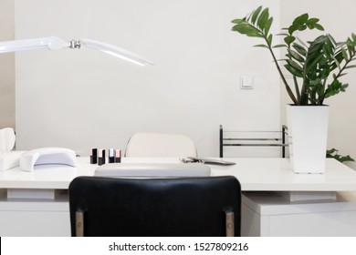 Interior Of Empty Modern Nail And Beauty Salon. Long Table With Lamp, Manicure Interior Business