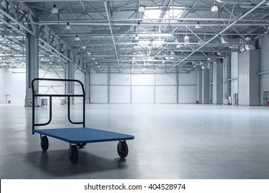 Interior Of Empty Warehouse With A Cart