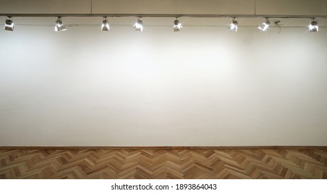 Interior Of A Empty White Wall With Spot Lights At Art Gallery