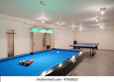 Interior Of An Entertainment Room, Billiard And Tennis Table Details.