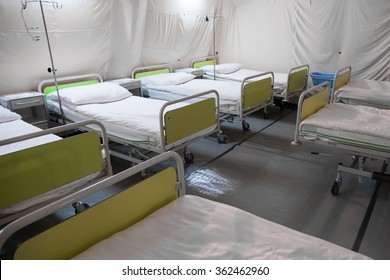 Interior Of Field Hospital Tent With Beds.