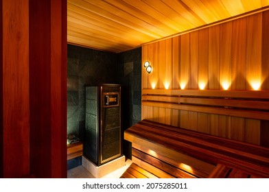 Interior Of A Finnish Sauna With A Stone Stove, Interior Of Wooden Finnish Sauna With Stove. The Finnish Sauna Is Traditional Culture