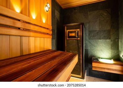 interior of a Finnish sauna with a stone stove, Interior of wooden finnish sauna with stove. The Finnish sauna is traditional culture