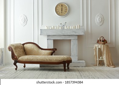 Interior with fireplace antique daybed and candles