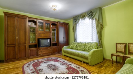 Interior Of Flat Room In Russian Soviet Style. Panorama Of Vintage Furniture, Carpet And Old TV Inside Living Room. Contemporary Apartment With Retro Decoration, 80s Design. Moscow - May 2, 2018