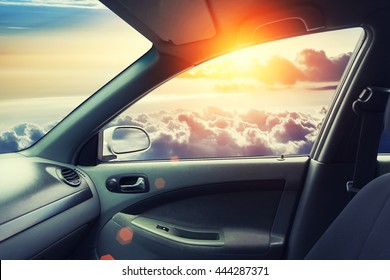 Interior Of Fly Car With Open Window And Sky On Side