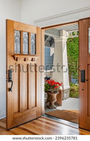 Similar – Image, Stock Photo Open front door of a Gründerzeit apartment building, doorbell signs, graffiti and shadows a