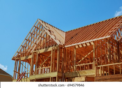 Interior framing of a new house under construction Home Under Construction - Shutterstock ID 694579846