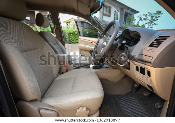 interior front seat\
of vehicle car\
automobile