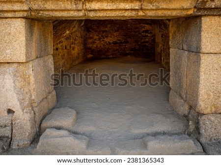 Interior of a gladiator room or beast cages in the Mérida amphitheater, made of rock blocks and bricks with a floor of sand and earth.