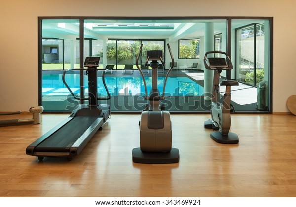 Interior, gym of a modern\
house with spa