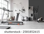 Interior of gym with modern sports equipment