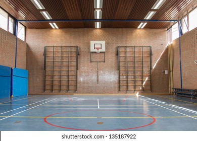 Interior Of A Gym At School, Jumping High At The Basket