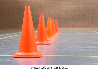 Interior Of A Gym At School, Red Cones On A Row