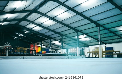 Interior hall of empty gymnastics arena, building and floor for training, professional performance or class. Backgrounds, studio space and room for sports, workout or indoor athletic practice - Powered by Shutterstock