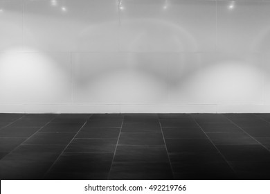 Interior Hall White Wall With Black Stone Floor With Spot Light For Background.