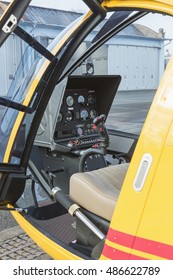  Interior of helicopter control dashboard, Instruments panel of a helicopter cockpit. Heli on the ground.