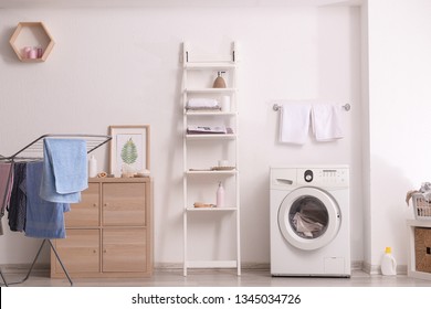 Interior Of Home Laundry Room With Modern Washing Machine