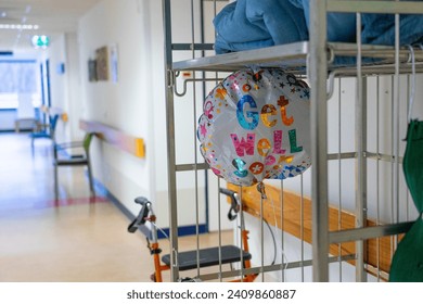 Interior of a Hospital with a balloon with the words "Get Well Soon" - Powered by Shutterstock