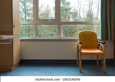 An Interior Of A Hospital Room With Chair Window And Curtains, Concept For Loneliness