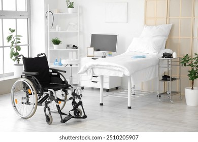 Interior of hospital ward with bed and wheelchair - Powered by Shutterstock