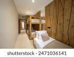 Interior of a hotel bedroom with bunk beds