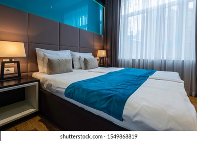 Interior of a hotel bedroom - Image - Shutterstock ID 1549868819