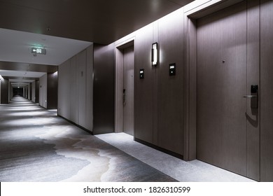 Interior of the Hotel corridor, with wood-paneled walls and elegant carpets