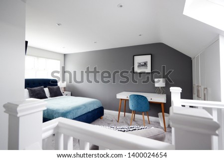 Interior of a house, loft conversion bedroom seen across stair banister