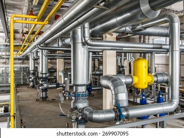interior industrial gas boiler with a lot of piping, pumps and valves - Shutterstock ID 269907095