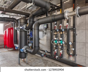 interior of industrial, gas boiler room with boilers; pumps; sensors and a variety of pipelines.
