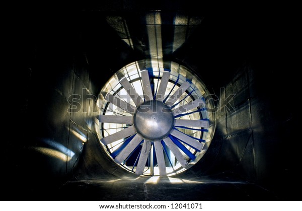 The interior of an\
industrial wind tunnel