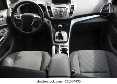 interior inside car, driver's seat, steering wheel and control panel