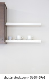 Interior kitchen shelf with coffee cup with empty wall