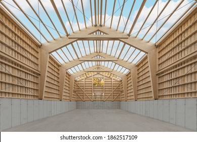 Interior of a large agricultural wooden hall during construction with an open roof