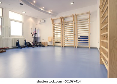 Interior Large Room, No People, Fitness Gym Physical Therapy, Equipment, Wall Bars, Bike