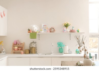 Interior of light kitchen decorated for Easter with counters and shelf