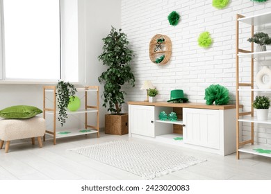 Interior of light living room with white furniture and decorations for St. Patrick's Day celebration - Powered by Shutterstock