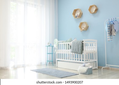Interior Of Light Modern Baby Room With Crib