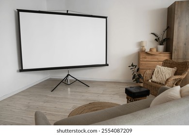 Interior of light room with projector screen and armchair