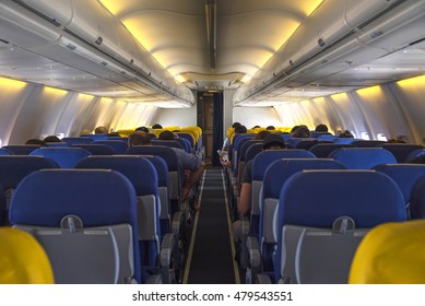 Interior Lights Of Aeroplane Or Airplane With Passengers On Seats Waiting Plan To Taik Off.
