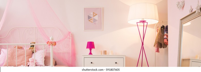 Interior Of Little Girl's Pink And White Bedroom