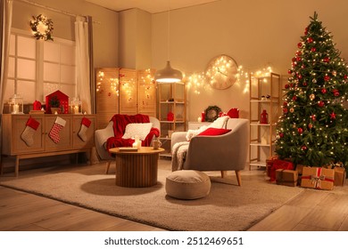 Interior of living room with armchairs, Christmas tree and glowing lights at night - Powered by Shutterstock