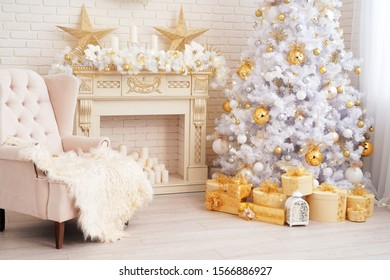 the interior of the living room in bright colors, decorated for Christmas. high and fluffy white Christmas tree next to the fireplace decorated with garland and wink. light chair by the window