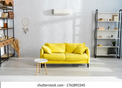 Interior Of Living Room With Coffee Table Near Yellow Couch