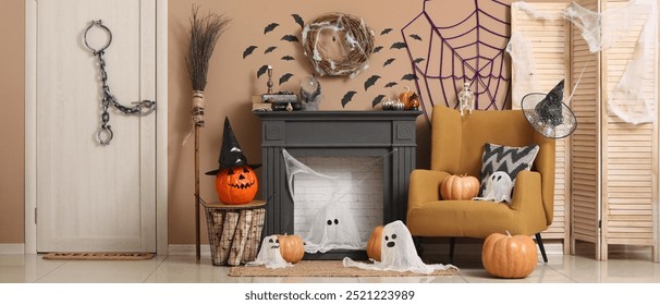 Interior of living room with fireplace, armchair and Halloween decorations - Powered by Shutterstock