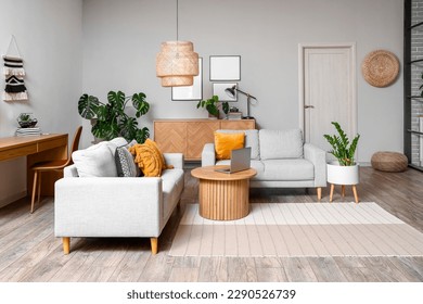 Interior of living room with green houseplants and sofas - Shutterstock ID 2290526739